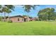 Lush green backyard offering ample space and serene outdoor living at 104 Nathan Hale Ct, Daytona Beach, FL 32119