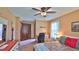 Comfortable bedroom featuring a desk, ceiling fan, and a closet at 104 Nathan Hale Ct, Daytona Beach, FL 32119