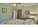 Bedroom featuring green walls, dresser, bed, round mirror and closet at 104 Nathan Hale Ct, Daytona Beach, FL 32119