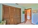 Bedroom featuring closet with louvered doors and a second door leading to another room at 104 Nathan Hale Ct, Daytona Beach, FL 32119