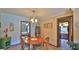 Inviting dining room with hardwood furniture and neutral walls at 104 Nathan Hale Ct, Daytona Beach, FL 32119