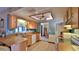 Well-lit kitchen featuring tile floors, white appliances, and wooden cabinets at 104 Nathan Hale Ct, Daytona Beach, FL 32119