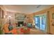 Comfortable living space featuring a brick fireplace and a bright, airy atmosphere at 104 Nathan Hale Ct, Daytona Beach, FL 32119