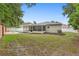 Private backyard with a serene pool, a screened lanai, and neatly manicured landscaping at 105 Golfside Cir, Sanford, FL 32773