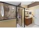 Bathroom featuring glass enclosed shower with granite design and updated vanity at 105 Golfside Cir, Sanford, FL 32773