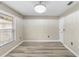 This room offers neutral paint, plank floors, a window and a ceiling light at 105 Golfside Cir, Sanford, FL 32773