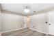 This room features plank floors, neutral paint, and a modern ceiling light at 105 Golfside Cir, Sanford, FL 32773