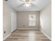This bedroom features plank floors and a window at 105 Golfside Cir, Sanford, FL 32773