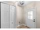 Bright foyer featuring a decorative front door with glass insert, tile floor, and coat closet at 105 Golfside Cir, Sanford, FL 32773