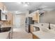 Bright kitchen features stainless steel appliances, tile floors, and neutral countertops and cabinets at 105 Golfside Cir, Sanford, FL 32773