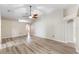 Expansive living room with wood floor, neutral color scheme, and ample space for furniture arrangement at 105 Golfside Cir, Sanford, FL 32773