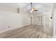 Large living room with wood floor and high ceilings offering a view of the kitchen at 105 Golfside Cir, Sanford, FL 32773