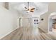 Spacious living room with new wood floor, ceiling fan, and lots of natural light throughout at 105 Golfside Cir, Sanford, FL 32773