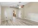 Main bedroom featuring neutral paint, wood-look floors and access to the ensuite bathroom at 105 Golfside Cir, Sanford, FL 32773