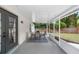 This screened patio includes outdoor furniture at 105 Golfside Cir, Sanford, FL 32773