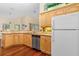 Charming kitchen with stainless steel appliances, wooden cabinets, and laminate countertops at 105 Riviera Estates Blvd, Ormond Beach, FL 32174