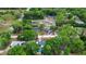 A neighborhood view showcasing beautiful mature trees, paved roads, and well-maintained homes at 1135 5Th St, Orange City, FL 32763