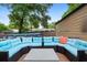 Backyard patio with an outdoor seating area perfect for enjoying the green surroundings at 1135 5Th St, Orange City, FL 32763