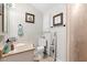 Small bathroom with a vanity, toilet, mirror, and tile flooring, providing essential amenities at 1135 5Th St, Orange City, FL 32763