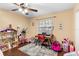 Versatile bedroom with a desk, dollhouse, and an exercise machine with natural light at 1135 5Th St, Orange City, FL 32763