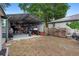 View of the metal garage and yard behind the house at 1135 5Th St, Orange City, FL 32763