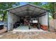 Spacious metal garage with a high ceiling, offering ample storage and workspace for hobbies and equipment at 1135 5Th St, Orange City, FL 32763