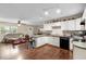 Open-concept kitchen with a breakfast bar that connects to the living area, perfect for hosting at 1135 5Th St, Orange City, FL 32763