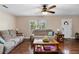 Cozy living room bathed in natural light, featuring comfortable seating and stylish decor for relaxation at 1135 5Th St, Orange City, FL 32763