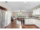 Open-concept living space combining a kitchen and living room for comfortable living and entertaining at 1135 5Th St, Orange City, FL 32763