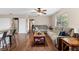 Inviting living room featuring hardwood floors, ceiling fan, and a comfortable seating arrangement at 1135 5Th St, Orange City, FL 32763
