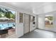 Cozy enclosed patio with natural light and a view of the pool, perfect for relaxing or entertaining at 1135 5Th St, Orange City, FL 32763