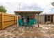 Backyard with an outdoor sitting area and green chairs for entertaining guests at 1148 Briarwood Ave, Deltona, FL 32725