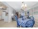 Open-concept dining area with views to the living room and kitchen, great for entertaining guests at 1148 Briarwood Ave, Deltona, FL 32725