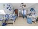 Cozy living area with ample seating, complemented by blue and white decorative elements at 1148 Briarwood Ave, Deltona, FL 32725