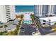 Aerial view showcasing the condo complex nestled between the ocean and adjacent buildings with dedicated parking at 1167 Ocean Shore Blvd # 110, Ormond Beach, FL 32176