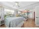 Bright bedroom with mirrored wall, ceiling fan and two queen beds with beach decor at 1167 Ocean Shore Blvd # 110, Ormond Beach, FL 32176