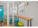 A quaint living area with coastal decor and colorful bar stools at 1167 Ocean Shore Blvd # 110, Ormond Beach, FL 32176