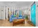 Bright living room with tile flooring, coastal decor, and stylish furnishings at 1167 Ocean Shore Blvd # 110, Ormond Beach, FL 32176