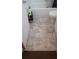 Bathroom with a standard white toilet and tub, featuring a neutral patterned floor at 1228 S Parsons Ave, Deland, FL 32720