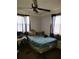 Bedroom featuring a ceiling fan, curtains, and a bed with pillows at 1228 S Parsons Ave, Deland, FL 32720