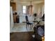 Kitchen with basic appliances, including a refrigerator, freezer, and table at 1228 S Parsons Ave, Deland, FL 32720