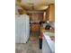 Kitchen featuring a full-size refrigerator and cabinets at 1228 S Parsons Ave, Deland, FL 32720