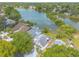 Beautiful aerial view of a community with waterfront homes, lush landscaping, and scenic lake views at 1229 Saddleback Ridge Rd, Apopka, FL 32703