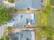 Bird's-eye view of attractive homes with well-kept lawns, close to a tranquil lake and lush greenery at 1229 Saddleback Ridge Rd, Apopka, FL 32703