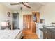 Bedroom with ceiling fan, wood floor, closet, modern art, and dresser with storage at 1229 Saddleback Ridge Rd, Apopka, FL 32703
