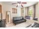Cozy bedroom with a ceiling fan, large mirror, and ample natural light from the window at 1229 Saddleback Ridge Rd, Apopka, FL 32703