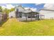 Exterior of a home with a screen porch, and wood deck overlooking a spacious lawn at 1229 Saddleback Ridge Rd, Apopka, FL 32703