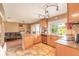 View from kitchen, featuring stainless steel appliances, granite counters, and open-concept living room layout at 1229 Saddleback Ridge Rd, Apopka, FL 32703