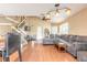 Open living area with a staircase, wood floors, and a spacious seating arrangement at 1229 Saddleback Ridge Rd, Apopka, FL 32703
