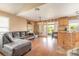 Spacious living room area with comfortable seating, adjacent to the kitchen and patio access at 1229 Saddleback Ridge Rd, Apopka, FL 32703